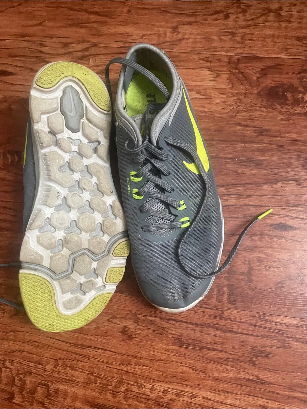 Nike women’s Gray & Neon Yellow Training Sneakers